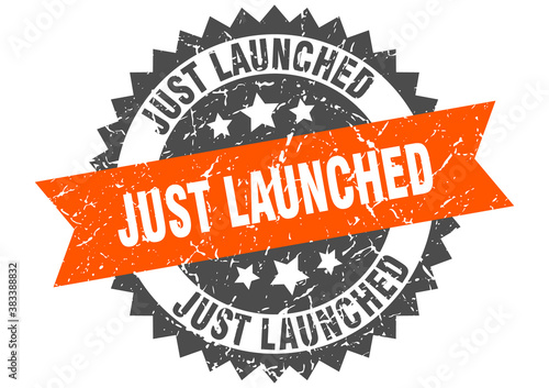 just launched stamp. grunge round sign with ribbon