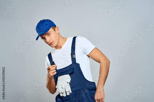 working man in uniform service lifestyle delivery service light background