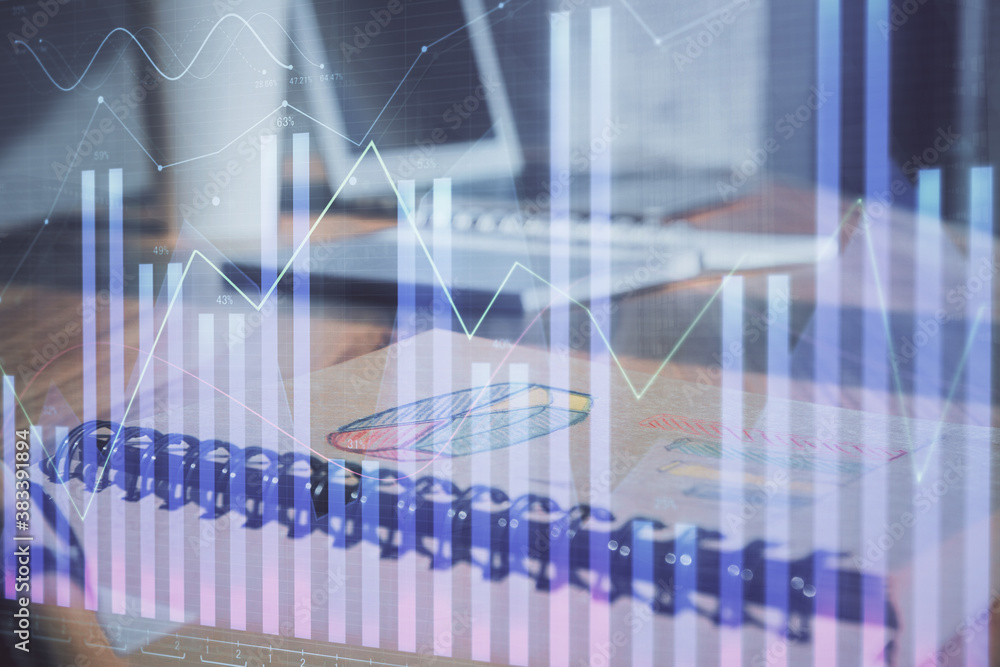 Double exposure of financial graph drawings and desk with open notebook background. Concept of forex market Double exposure of financial graph drawings and desk with open notebook background. Concept of forex market