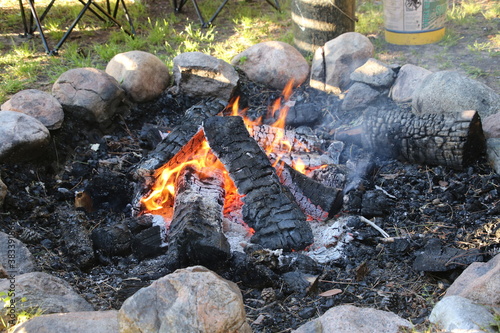 Close up of a rock edged blazing campfire