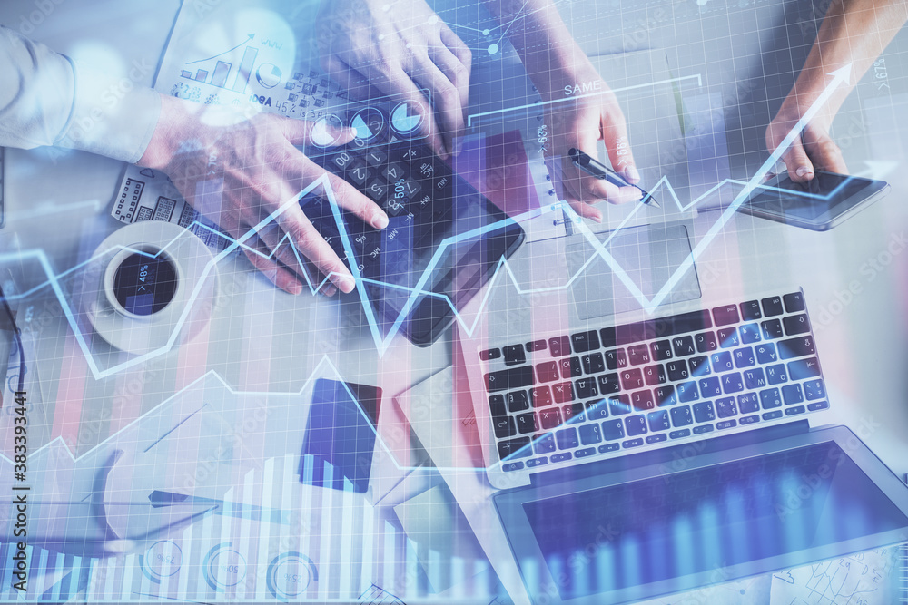 Double exposure of man and woman working together and financial chart hologram drawing. market analysis concept. Computer background. Top View. Double exposure of man and woman working together and financial chart hologram drawing. market analysis concept. Computer background. Top View.
