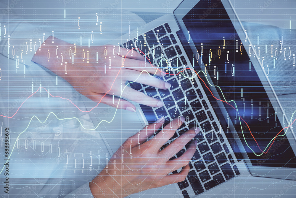 Double exposure of woman hands working on computer and forex chart hologram drawing. Top View. Financial analysis concept. Double exposure of woman hands working on computer and forex chart hologram drawing. Top View. Financial analysis concept.