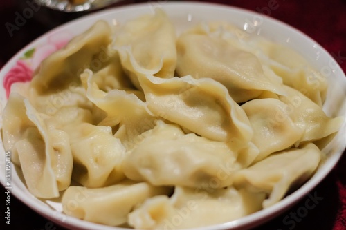 Boiled Chinese dumplings in a plate close up Chinese New Year