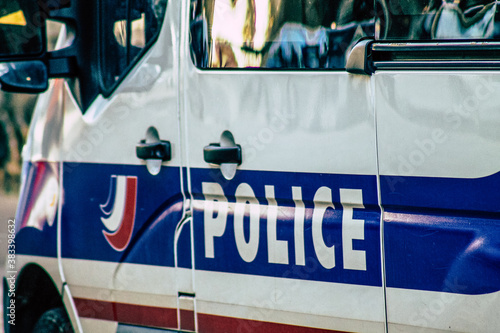 Closeup of an official police car patrolling the streets of the city center of the metropolitan area 
