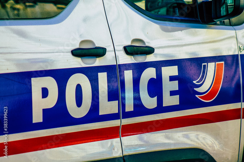 Closeup of an official police car patrolling the streets of the city center of the metropolitan area
