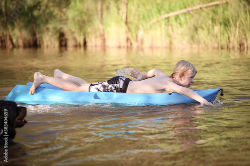 Boy kayaking Goulburn River, New South Wales Australia. Adventure holiday family road trip.