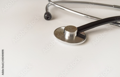 Closeup of a medical stethoscope on white background, concept of medicine