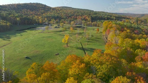 Flyover view of Vermont horse farm estate in autumn splendor.
