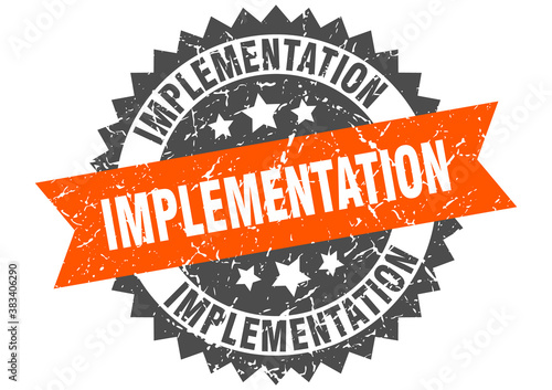 implementation stamp. grunge round sign with ribbon