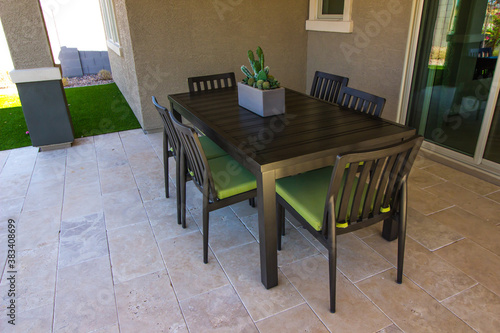 Simple Patio Table & Chairs On Rear Yard Patio