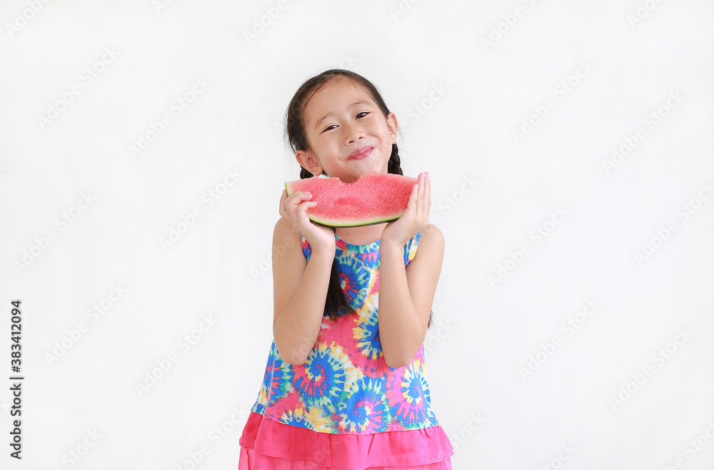 Happy asian little child girl eating watermelon isolated on white background Happy asian little child girl eating watermelon isolated on white background