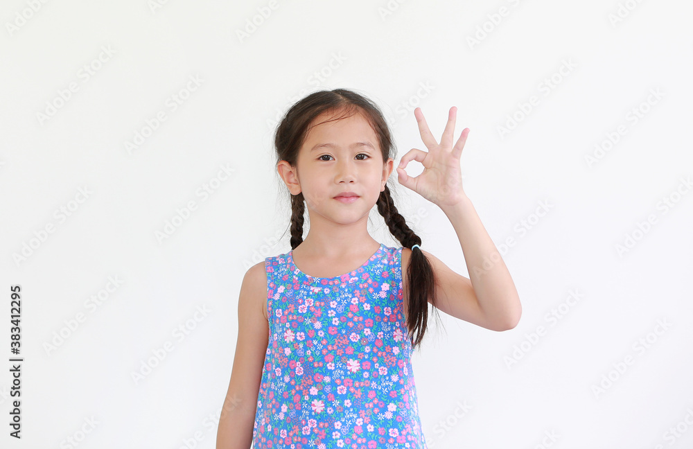 asian little child girl show finger okay symbol sign language isolated on white background. asian little child girl show finger okay symbol sign language isolated on white background.