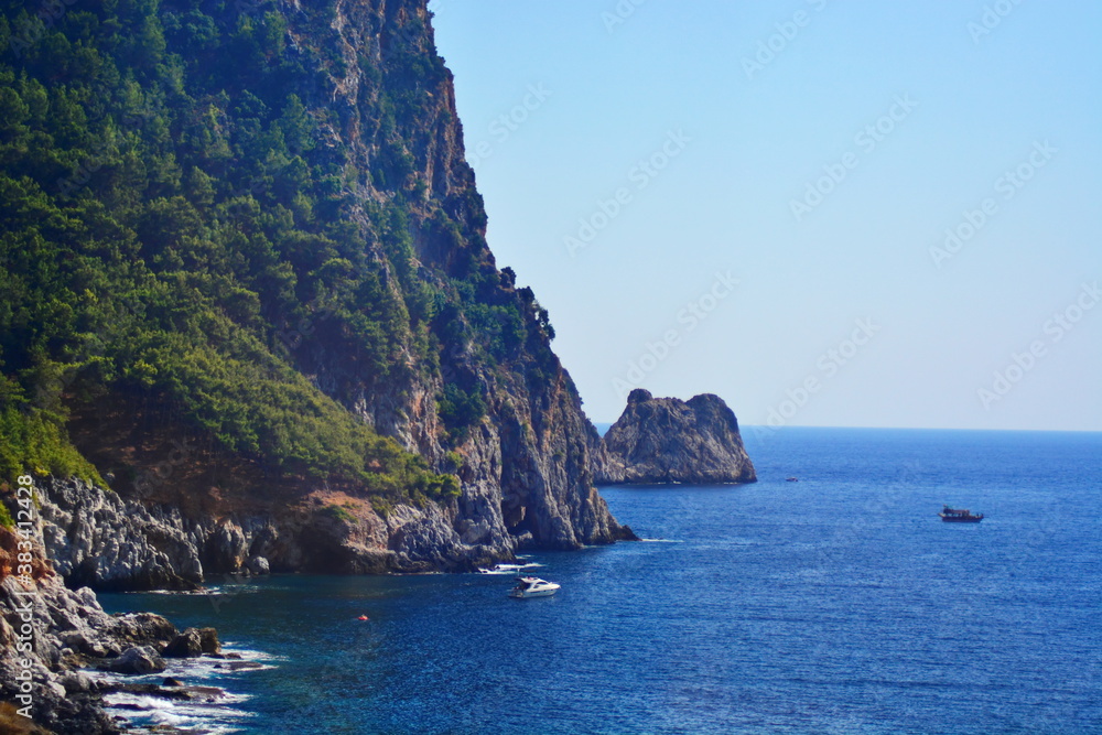 The coast of the Mediterranean sea with cliffs, Islands and yachts. Turkey, Alanya
