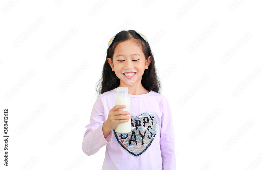 Happy asian little kid girl drinking milk from glass bottle isolated on white background. Happy asian little kid girl drinking milk from glass bottle isolated on white background.