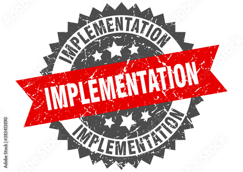 implementation stamp. grunge round sign with ribbon