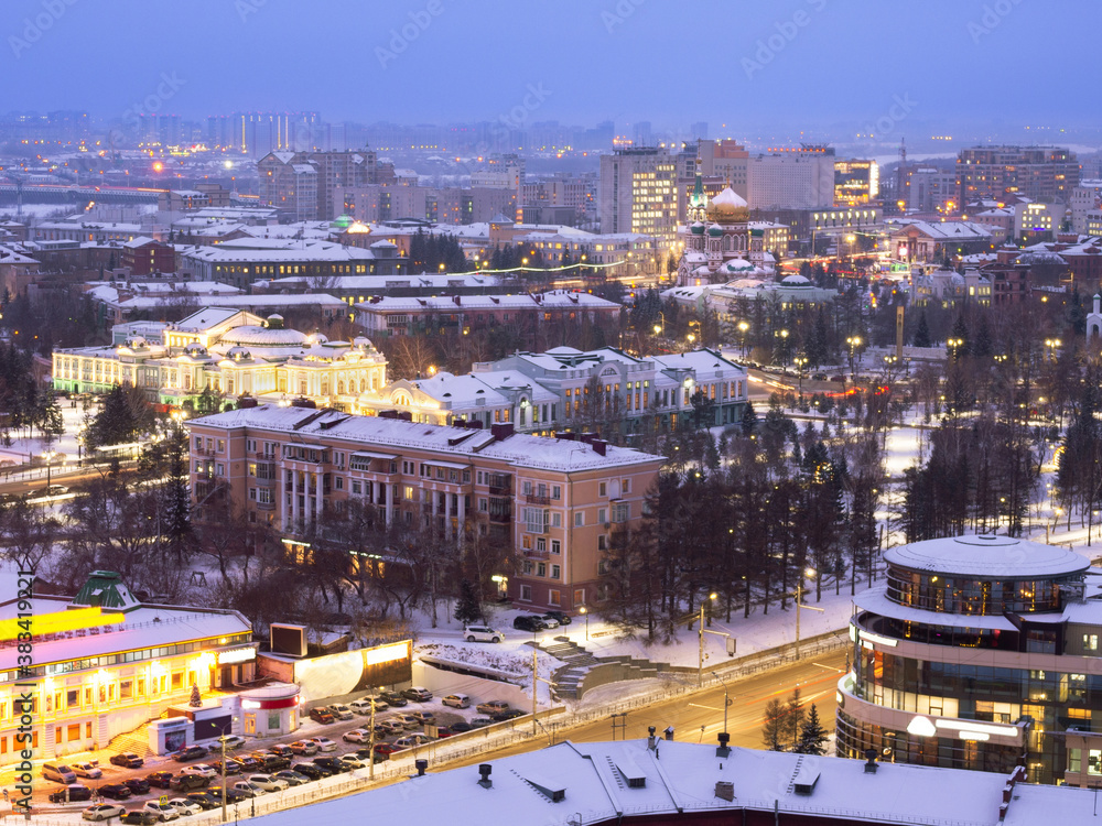 Drama Theater, Vrubel Museum of Fine Arts, Assumption Cathedral and Dzerzhinsky Square from a height in the winter evening in Omsk.