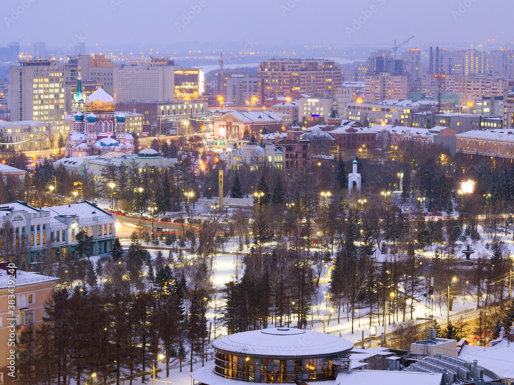 Fototapeta premium Assumption Cathedral and Dzerzhinsky Square from a height in the winter evening in Omsk. 