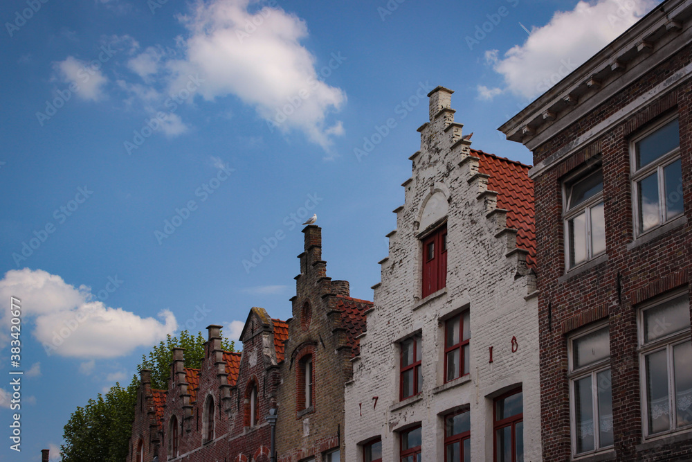 Roofs And Windows Of Old Authentic Brick Houses In Bruges, Belgium