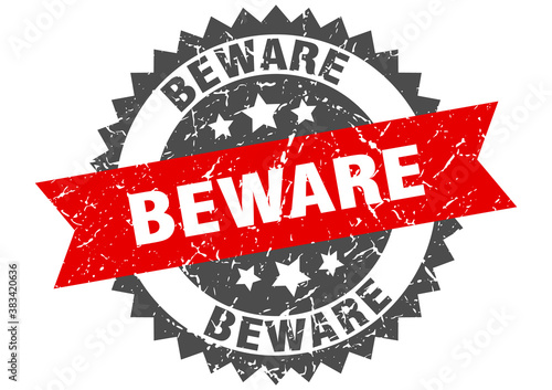 beware stamp. grunge round sign with ribbon