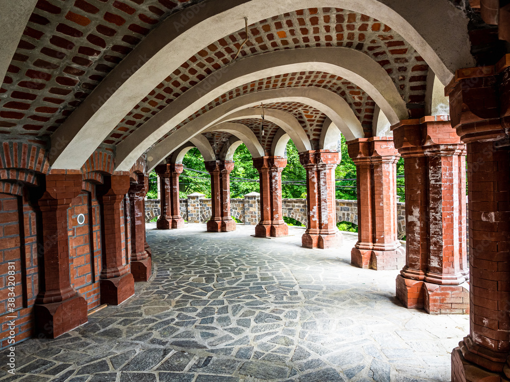 Beautiful archway with white and brown brick into geometrical design 