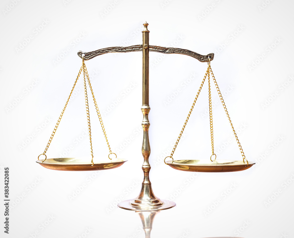Symbol of justice: Law scales on table isolated on white background Symbol of justice: Law scales on table isolated on white background