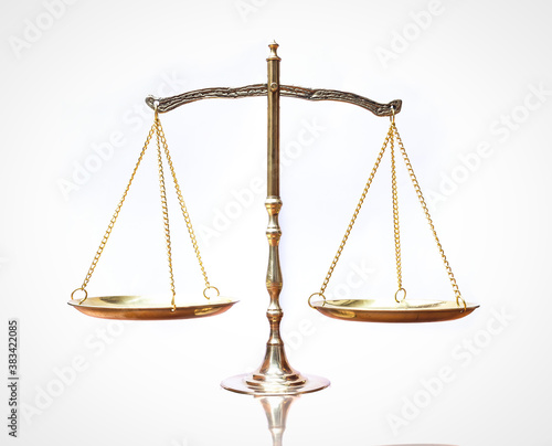 Symbol of justice: Law scales on table isolated on white background