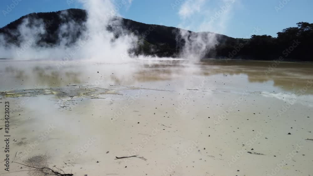 Steam on Active Geothermal Area in Taupo Volcanic Zone, North Island New Zealand . Waiotapu Thermal Wonderland, Scenic Hot Springs and Pools, Slow Motion Panorama Steam on Active Geothermal Area in Taupo Volcanic Zone, North Island New Zealand . Waiotapu Thermal Wonderland, Scenic Hot Springs and Pools, Slow Motion Panorama