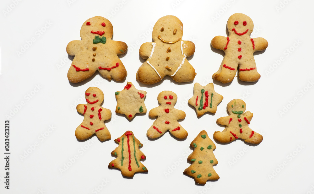 Group of homemade Christmas gingerbread cookies isolated on white background. Male or female cookies. Decorated Christmas cookies Group of homemade Christmas gingerbread cookies isolated on white background. Male or female cookies. Decorated Christmas cookies