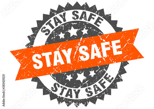 stay safe stamp. grunge round sign with ribbon