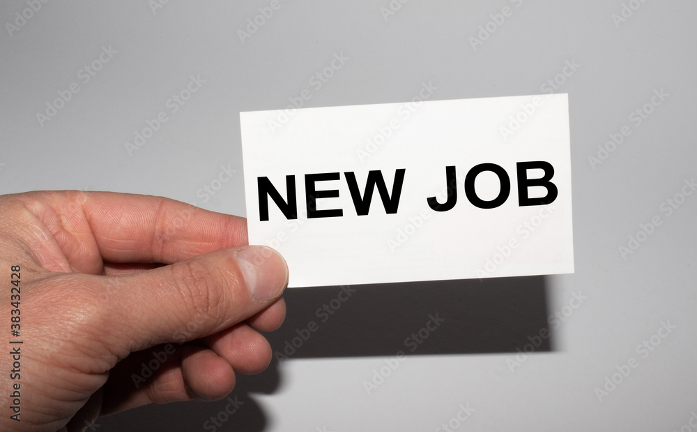 Message on the card NEW JOB, in hands of businessman. Message on the card NEW JOB, in hands of businessman.