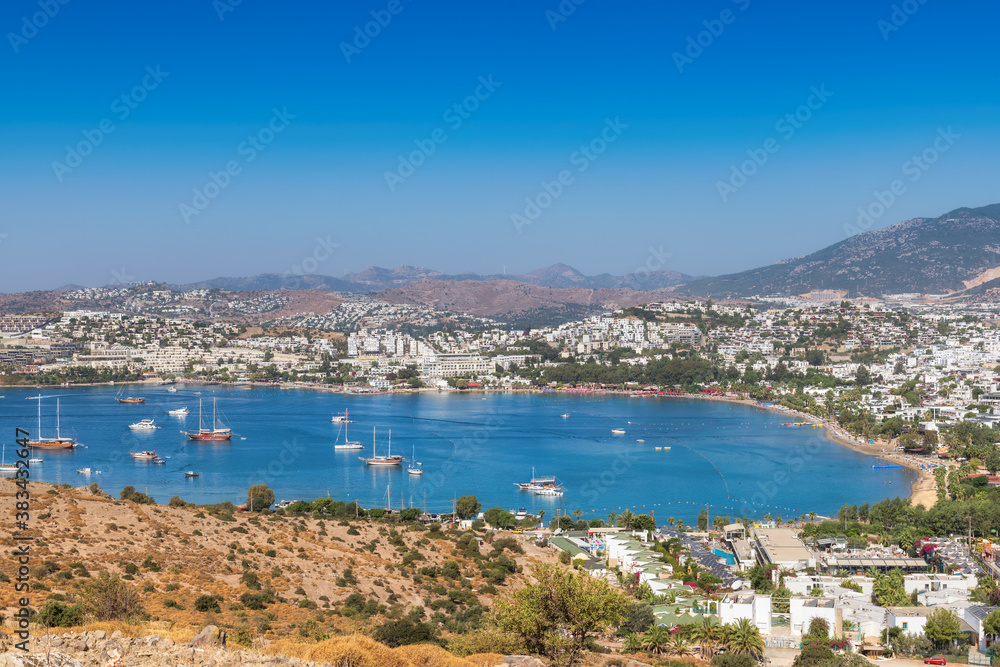 Bodrum coastline with sailboats and luxury yachts in harbor on the Aegean sea in Bodrum, Turkey.
