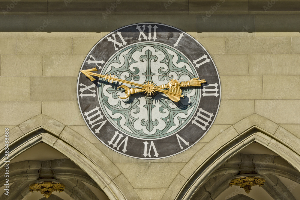 coat of arms and clock on the facade of the Town hall of Bern, Switzerland