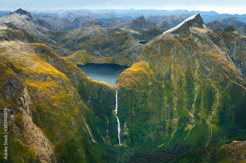 Amazing aerial view of mountain Lake Quill and Sutherland Falls on the scenic flight from Milford Sound to Queenstown, Fiordland, New Zealand