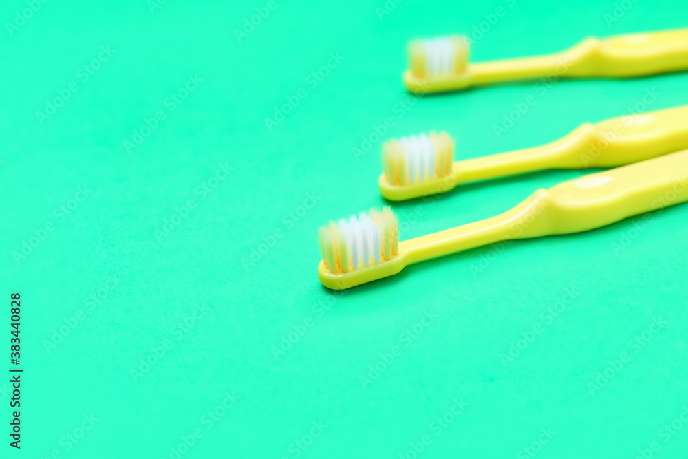 Tooth brushes on color background Tooth brushes on color background