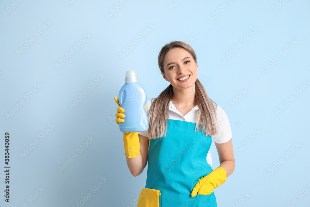 Young woman with detergent on color background Young woman with detergent on color background