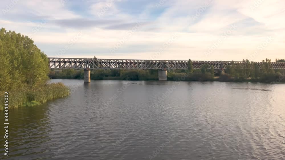 Panoramic view of the Guadiana river as it passes through the city of Mérida. In the background you can see the train bridge Panoramic view of the Guadiana river as it passes through the city of Mérida. In the background you can see the train bridge