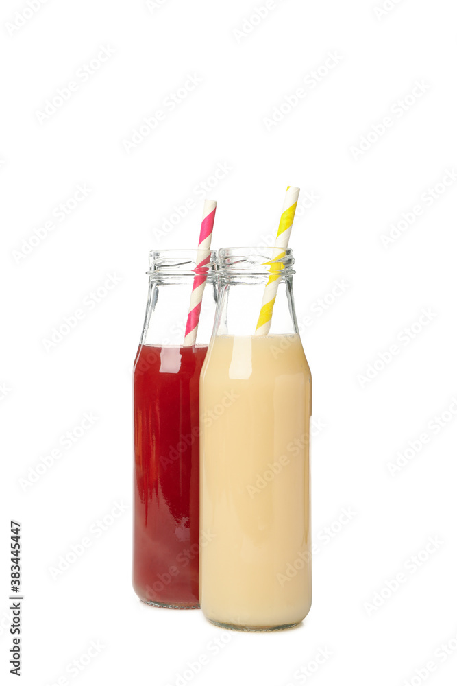 Bottles with strawberry and banana juices isolated on white background Bottles with strawberry and banana juices isolated on white background