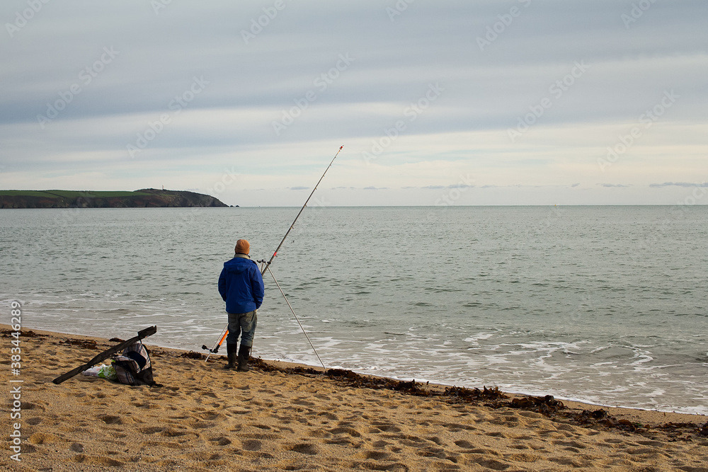 Fisherman On The Beach