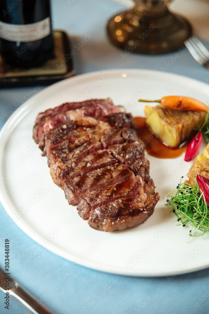 Cut grilled beef ribeye steak with potatoes Cut grilled beef ribeye steak with potatoes