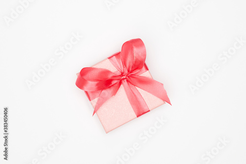 Pink christmas gift on white background isolate, flatley, copy space