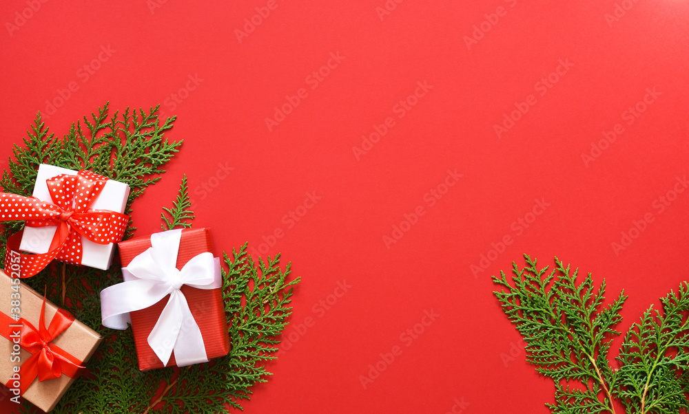 Beautiful Christmas decoration with fir and boxes with gifts. Christmas background. Flat.