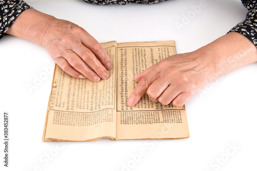Konstfotografi The old man is flipping through an old yellowed book