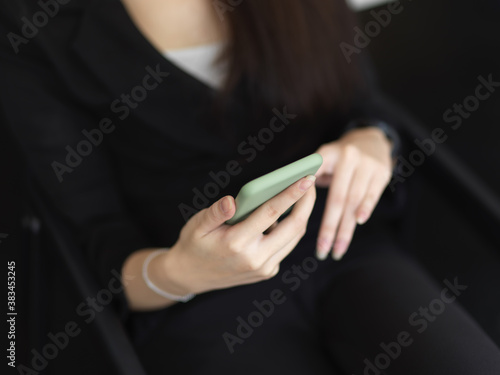 Close up view of female hands holding smartphone