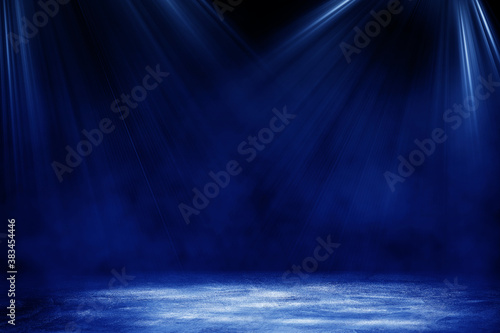 Empty space of Studio dark room concrete floor grunge texture background with blue lighting effect for product showing.
