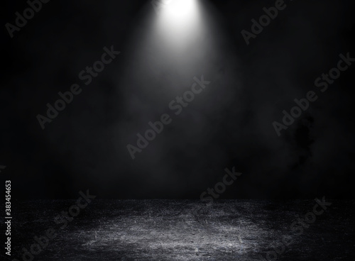 Empty space of Studio dark room with spot lighting and fog or mist on concrete floor grunge texture background.