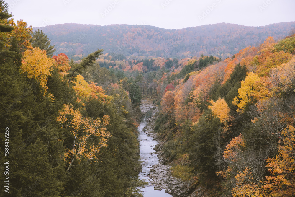 Ottauquechee River in Fall, Vermont Leaf peeping. Autumn in New England is known for its vibrant colors and picturesque beauty. 
