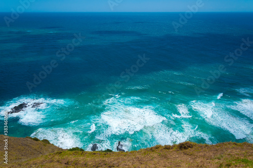 Amazing view from the cliff of Cape Reinga, the edge of the Northern Island, where Pacific ocean meets Tasman sea, New Zealand