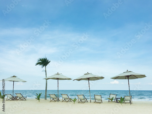 beach with umbrellas © thelittlebee