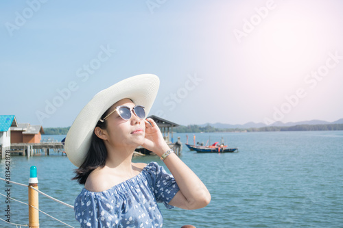 woman in hat on the beach