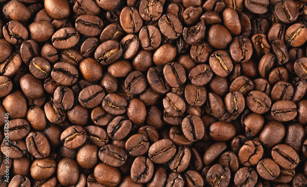 Obraz premium freshly roasted coffee beans background